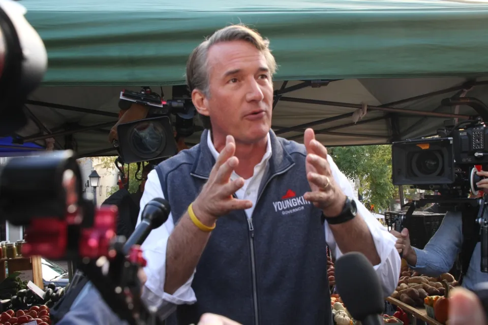 Glenn Youngkin gesturing with his hands while speaking to the media and the public while campaigning for governor of Virginia at the Alexandria Farmers Market.